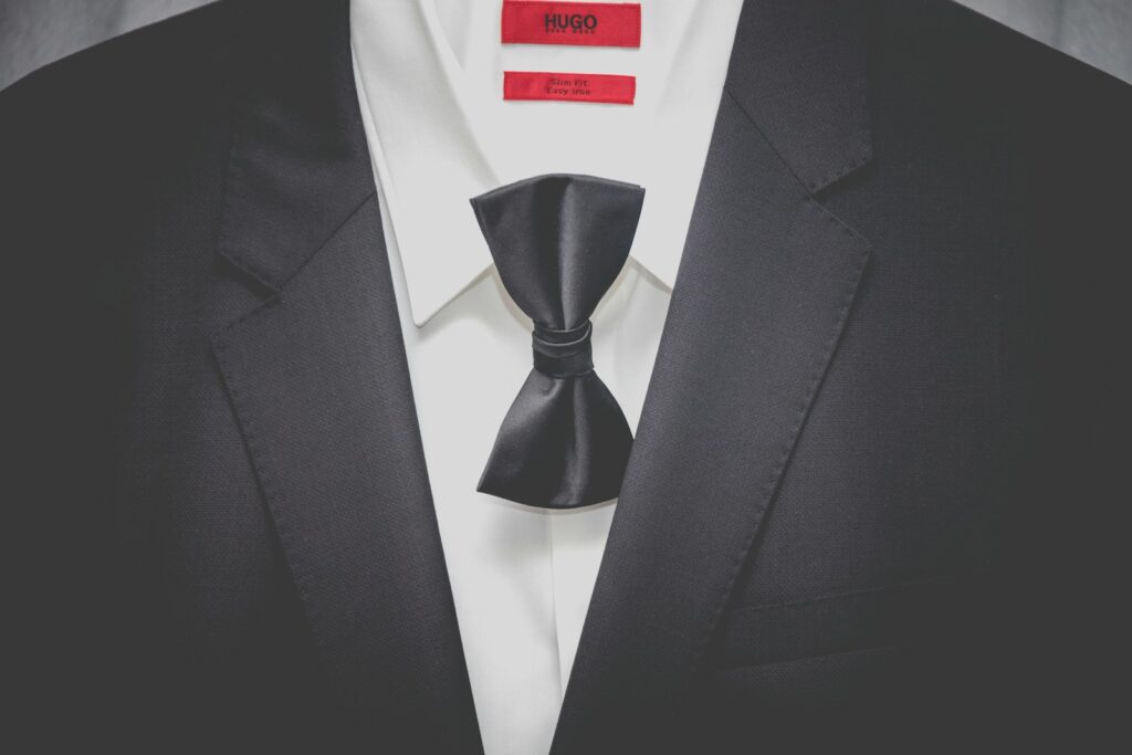 black notched lapel suit jacket and bowtie